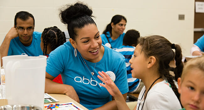 AbbVie employees lead a group of summer school students through Science Adventures, an interactive day of hands-on science activities in North Chicago, Ill.