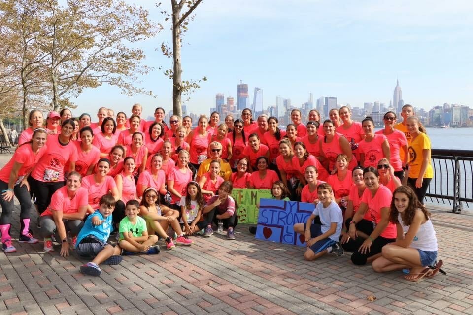 Danielle Taylor has persuaded more than 200 women to undertake strenuous obstacle course races to raise money for children in need.  This group poses in New Jersey in 2017 against the New York City skyline./ Courtesy Danielle Taylor