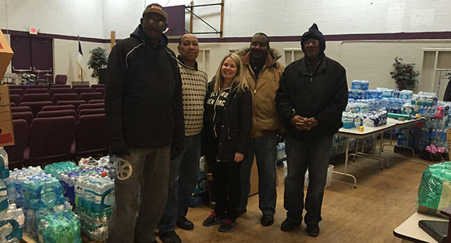 At the Calvary Community Church, volunteers assist with the collection and distribution of bottled water in the wake of Flint's lead water crisis.