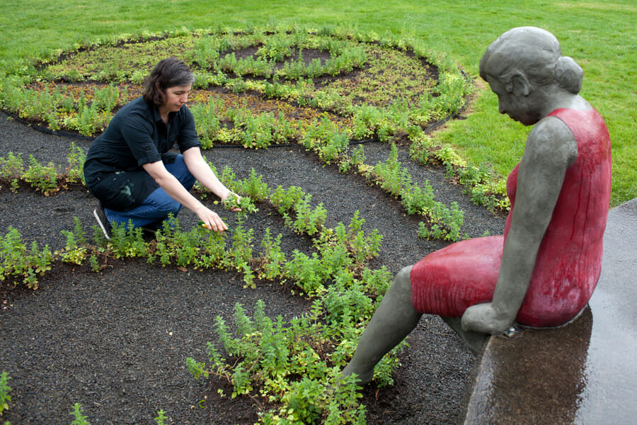 Wilson and her sculpture at the Clackamas Community College.Photo credit Aaron Johanson.