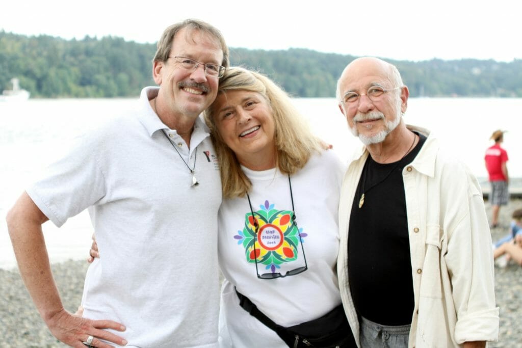 Nancy, center, with longtime camp volunteers, Stephen and Gordon
