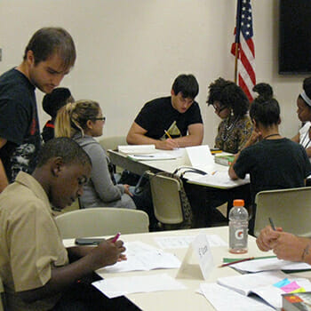 Tutors work with students at free K-12 math clinic.