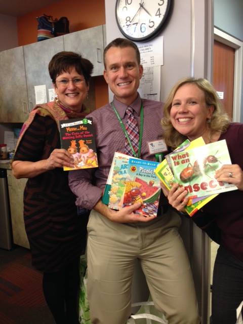 Three teachers with the books they received at Educator’s Night./ Courtesy Michele Duell