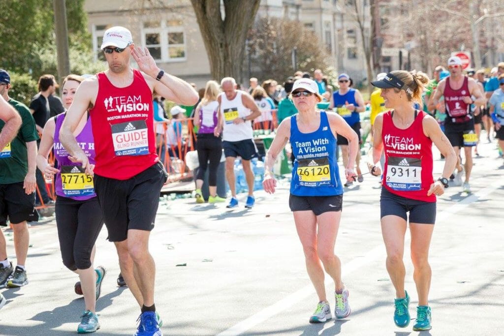 (middle) Seth running with fellow guides and partners in 2016 Boston Marathon/ Courtesy Rebecca Trachsel