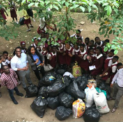 Students from the Herbert Macaulay Girls Senior High School in Lagos, Nigeria, and the recyclables they collected.