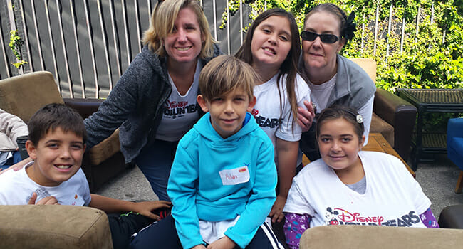 Laura Giron (top right), with her daughters Abree and Abby, attending a Big Sunday event with fellow volunteers Andrea, Gavin and Aidan.