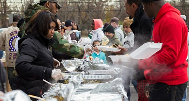 During the 30 Days of Giving project, Operation Heroes Connect hosts a dinner for the homeless citizens in Northern Virginia's "Tent City."