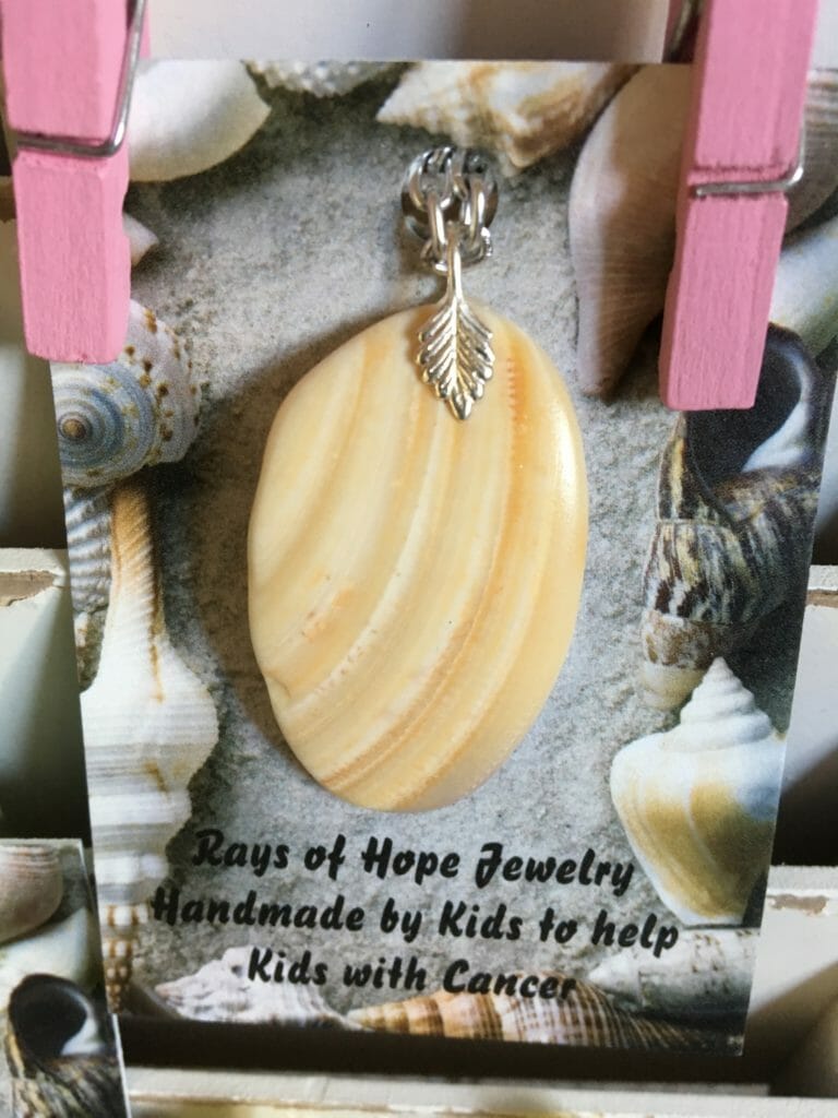 A seashell pendant necklace made by Jenna and Cara./ Courtesy Dennis Ainge