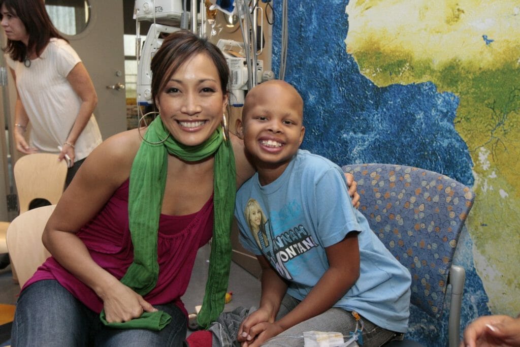 Carrie Ann Inaba, a judge on ABC's "Dancing with the Stars" and national celebrity spokesperson for Dréa's Dream, visiting with a patient at University of Los Angeles's Mattel Children's Hospital.