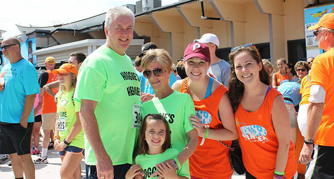 Maureen Walsh, a skin-cancer survivor and beneficiary of Bringing Hope Home, her husband, Chuck, and their granddaughter at the second annual Sea Isle STOMP, one of Bringing Hope Home's signature events.