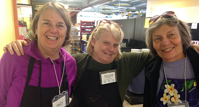 Barbara Motichka (far right) and fellow volunteers serving at the Metro Caring food pantry.