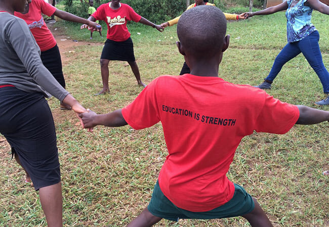 Students from Masulita Secondary School in Wakiso, Uganda, dancing after a MoonCatcher presentation./Courtesy Ellie von Wellsheim