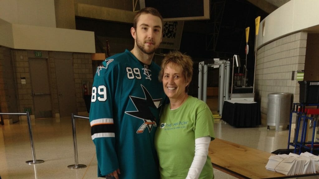 Marcia with Barclay Goodrow of the San Jose Sharks at the ‘Shark Tank’ where a marrow drive is held every year. /Courtesy Marcia Diefendorff 