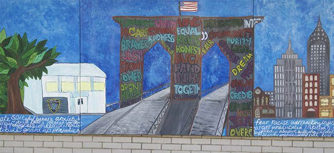 The mural created at the 90th precinct in Brooklyn, New York.