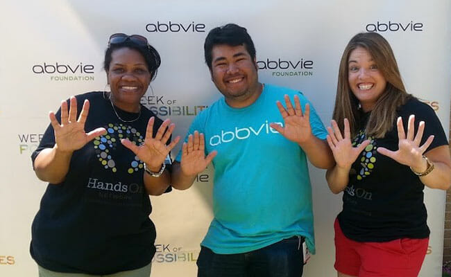 Jen Nash (left) and Kate Nichols (right) of Points of Light, with AbbVie intern Alex Porcayo at an AbbVie "Week of Possibilities" event.