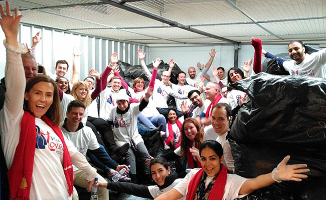 Hands On London volunteers celebrate the 7th year of the Wrap Up London coat drive campaign, during which they collected more than 20,000 coats to be distributed to homeless, elderly and refugee charities.