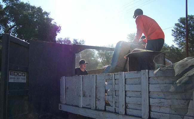 Community volunteers pitch in for preparations for the annual garbage disposal pick-up in Boulevard, Calif.