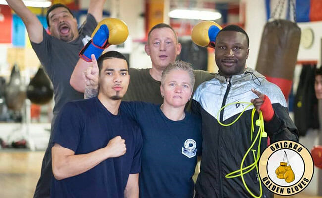 Rita Figueroa, center, coaches and mentors young men at the boxing gym, teaching them life skills and offering them a safe place to be.