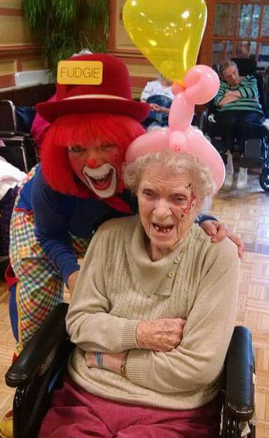 Maryann Greco, in her professional persona Fudgie the Clown, with mother during a visit to the Allendale Nursing Home.