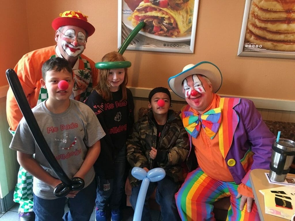 Marty (far right) dresses up as a Shirner clown to enterain local children at various events and hospitals./Courtesy Marty Haley