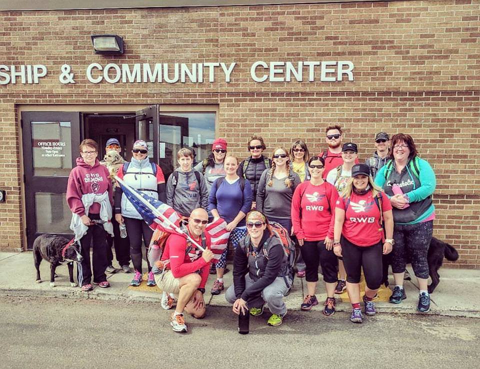 Thea (second row, second from right )and a group of volunteers collected food items for the Salvation Army at her fitness studio and hiked three miles to drop the items off./Courtesy Thea Ward Jorgensen