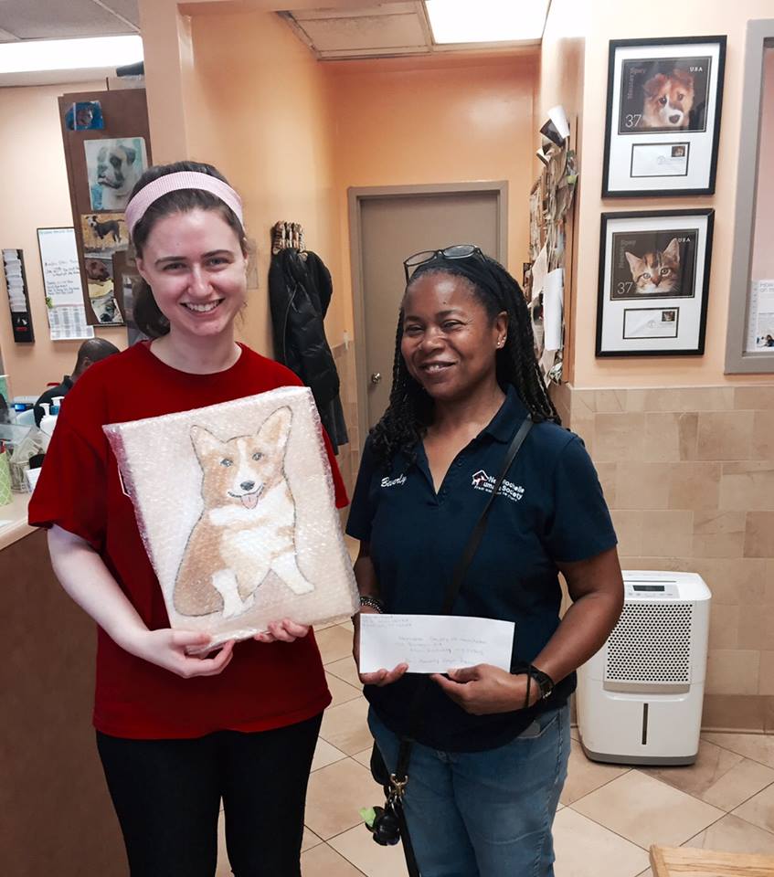 Annie (left) delivers one of her paintings to an animal shelter./Courtesy Annie Blumenfeld