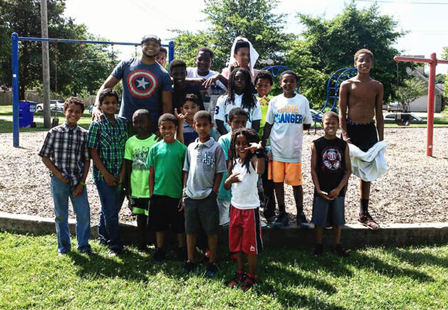 Devine Carama founded Believing In Forever to inspire youth through art, mentoring, education and community service. Here, Devine participates in the organization's Sons of Single Mothers mentoring program, which pairs men in the community with boys who don't have a positive male role model in their life.