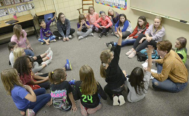 Volunteer student leaders engage Like A Girl participants in an empowerment icebreaker at Fredstrom Elementary School.