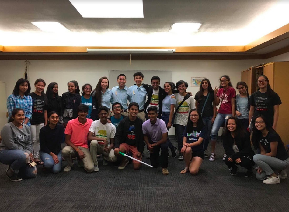 Ashton Lam(top-row, 7th from left) with fellow TakeOff founders and volunteers run an afternoon entrepreneurship bootcamp for high schoolers at the public library./Courtesy Ashton Lam