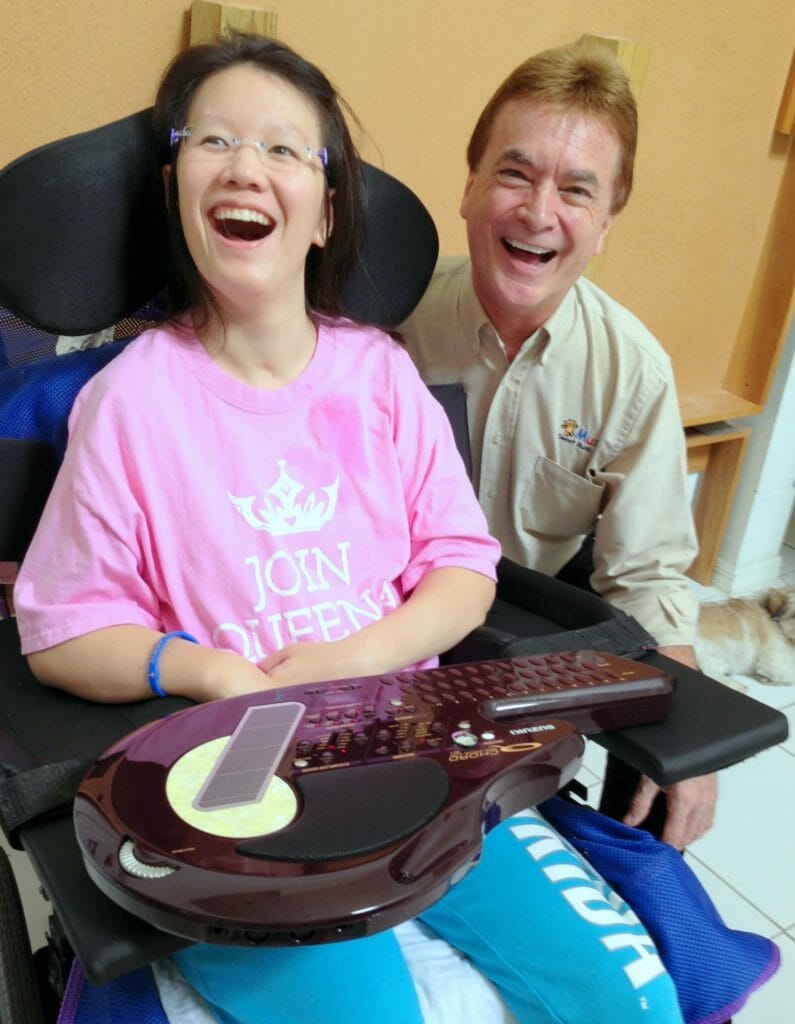 Ted (right) is pictured with a music therapy patient using the Q-Chord. The Q-Chord is used to increase coordination and stimulate the gross and fine motor skills of the user./Courtesy Ted Wagner