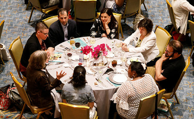 Attendees participate in a table discussion at the Service Supper, co-hosted by Points of Light and Repair the World.