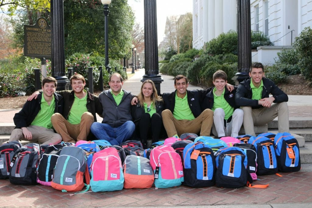 Zack Leitz (third from right) poses with Backpack Project team following a backpack packing before distributing supplies to homeless clients./Courtesy Zack Leitz