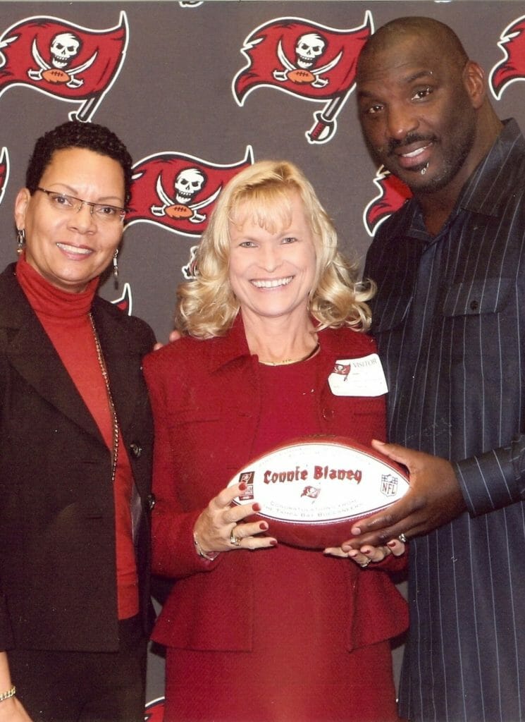 Connie Lindsay(center) receiving an award from Tampa Bay Buccaneers for her work with Liberty Manor./Courtesy Connie Lindsay