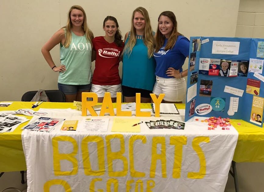 Hanna Posthauer (second from left) with other Rally members raising funds and awareness for Rally Foundation for childhood cancer research at a school event./Courtesy Hannah Posthauer