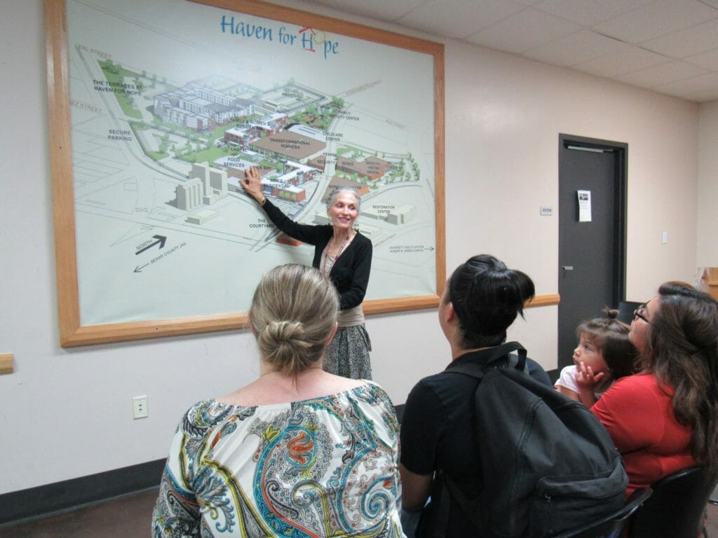 Susan Flores shows a map of the Haven for Hope campus before giving a tour./Courtesy Haven for Hope