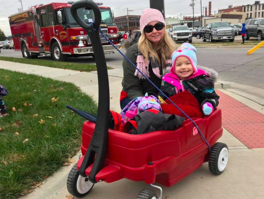 Jessica Richardson with Daughter Chloe at a Veterans Day parade in Fort Leavenworth while working with "Wreaths Across America"./Courtesy Jessica Richardson