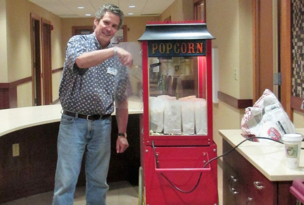 Gene Traudt makes popcorn in the Café Emporium of Milwaukee Catholic Home, which offers independent living, assisted living and nursing care options./Courtesy Milwaukee Catholic Home