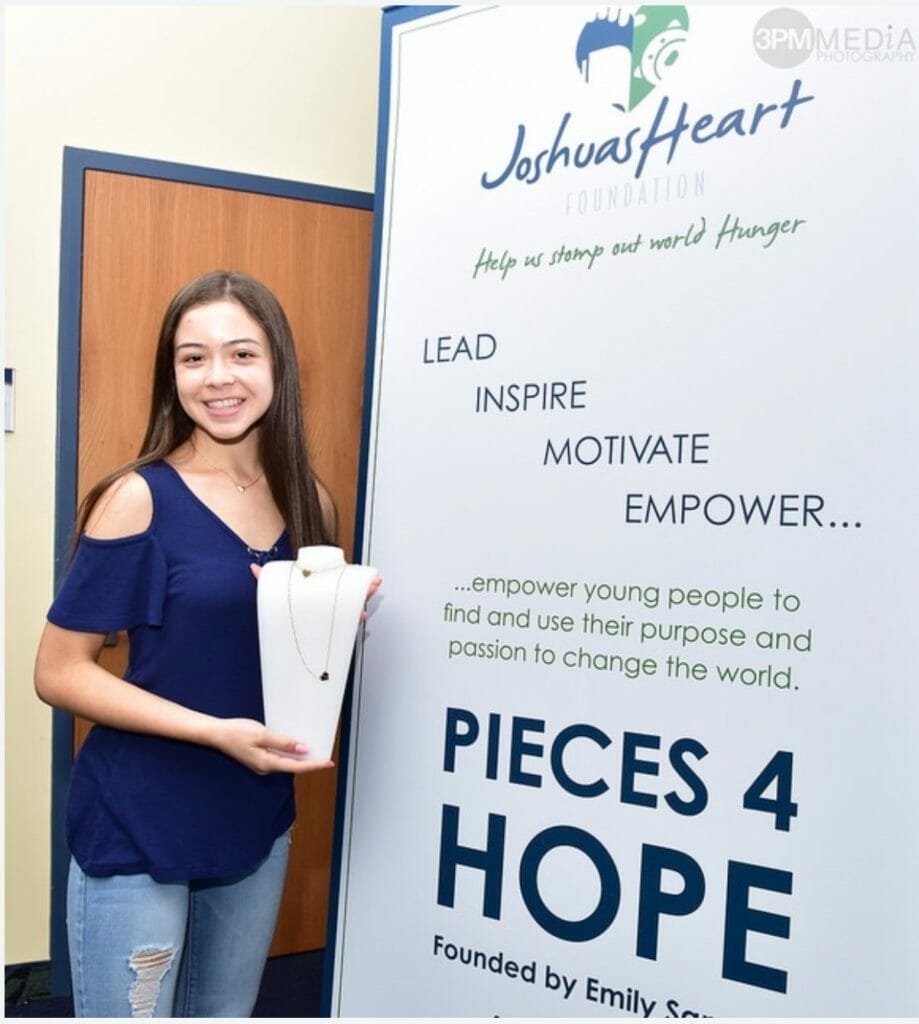 Emily Sanudo shows off her Pieces 4 Hope necklace, with all sales benefiting Joshua’s Heart Foundation./ Courtesy Emily Sanudo