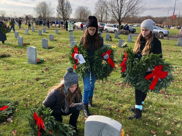 The DiFabio sisters volunteer annually at Wreaths Of Remembrance, helping to lay wreaths on over 2,700 graves at the Gloucester County Veterans Cemetery in New Jersey./Courtesy Alicia DiFabio