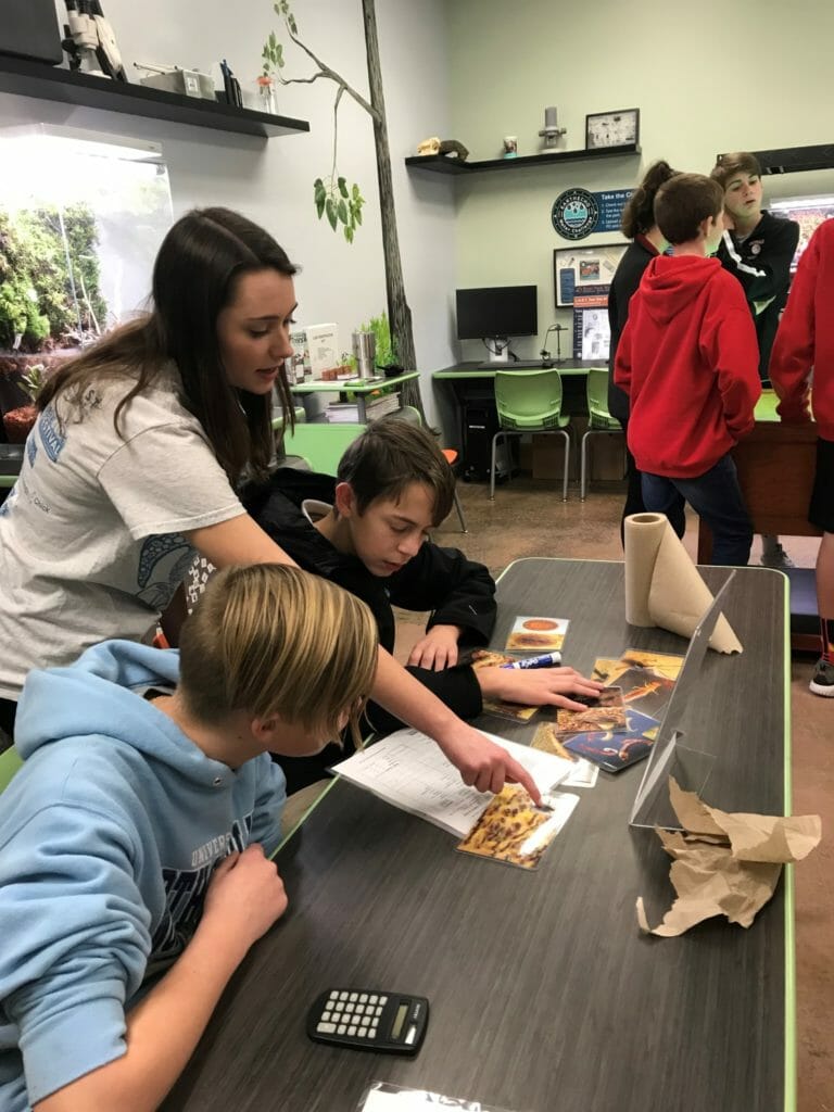 Katelyn Higgins assisting local middle school students learning about water science at River Park North in Greenville, North Carolina./Courtesy Dawn Higgins
