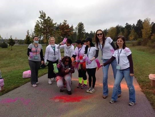 Michelle Merson (far Left) and other volunteers at a color run at the US Army garrison in Grafeonwehr, Germany./Courtesy John Merson 