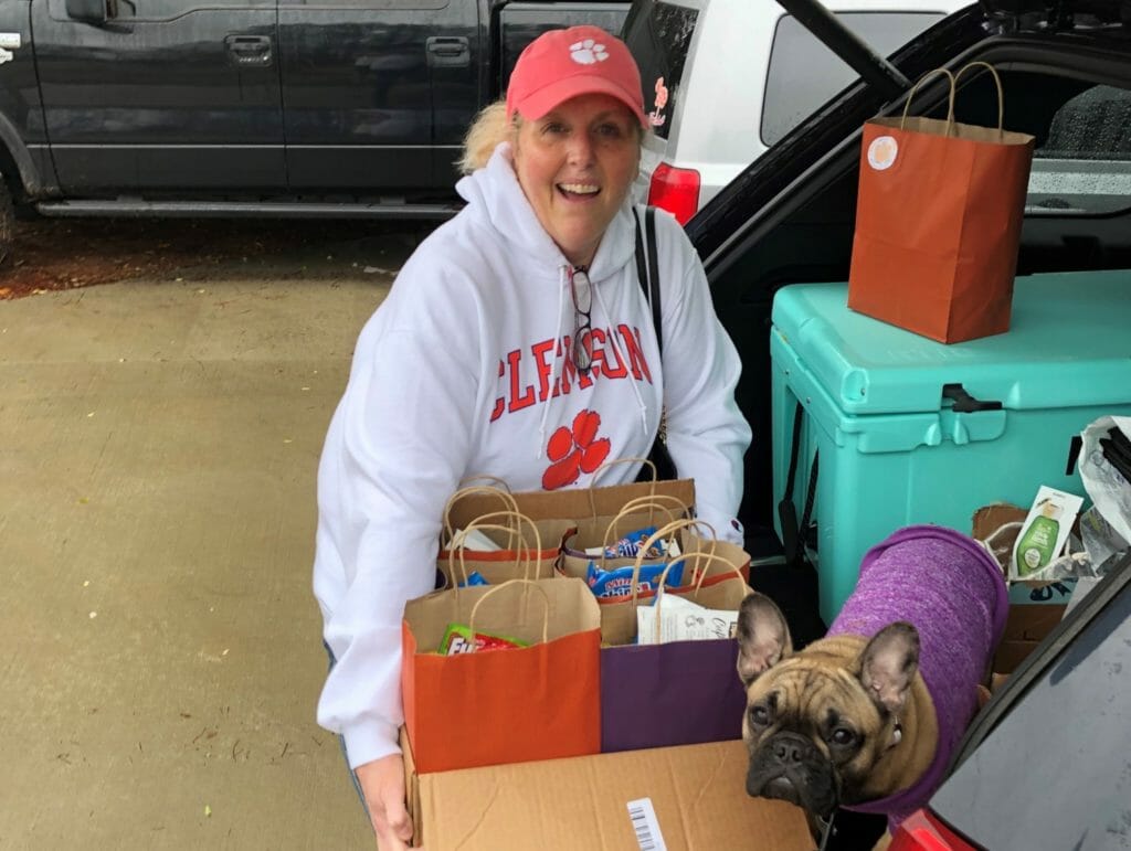 Carmen Burgess with Maggie, her service dog,  delivering the care packages./Courtesy Carmen Burgess