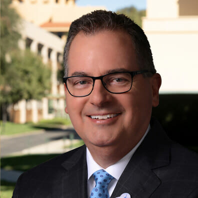 Portrait of George A. Kalogridis, Former President, Segment Development and Enrichment at Disney Parks, Experiences and Products.